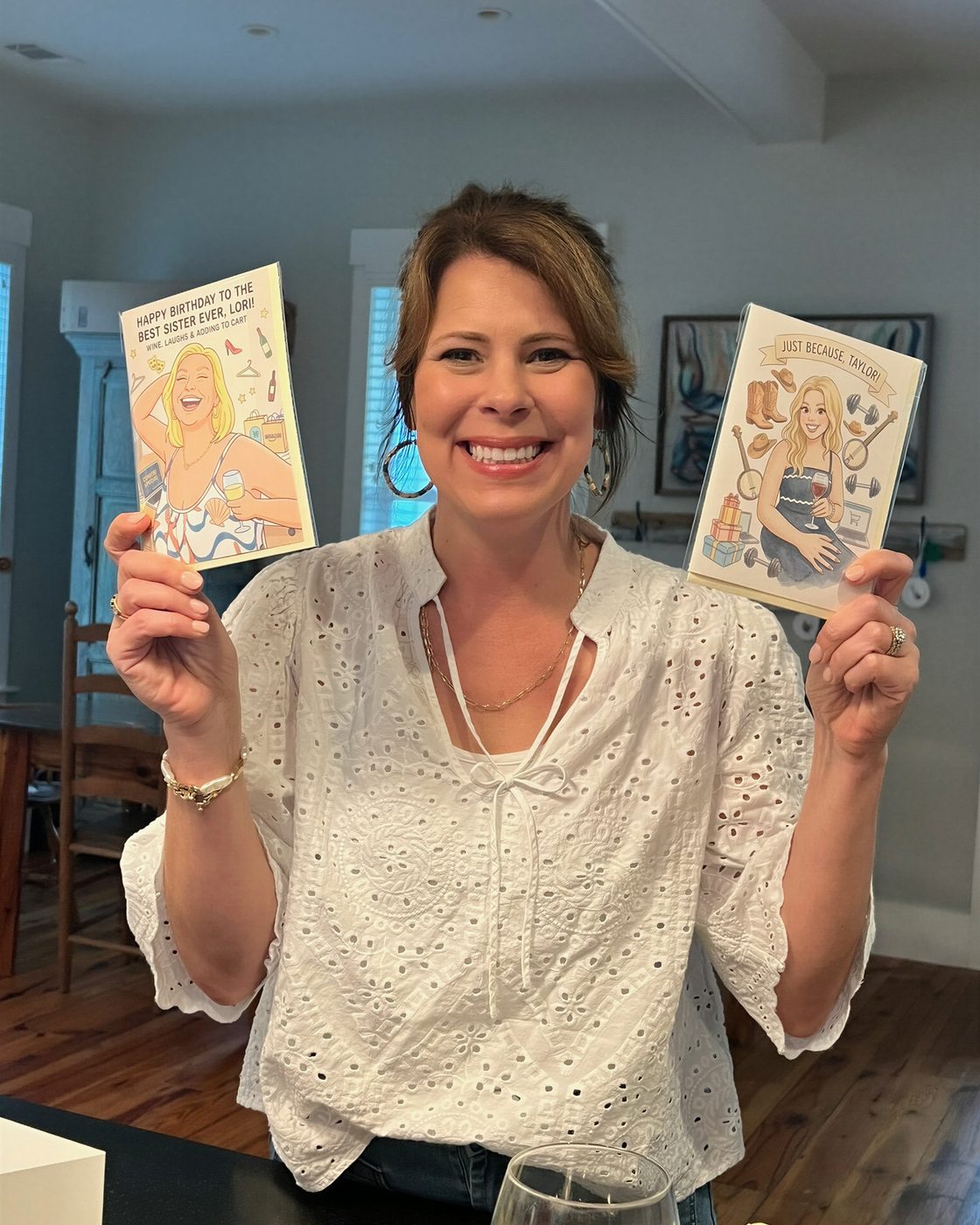 A P.S. customer holding two personalized greeting cards